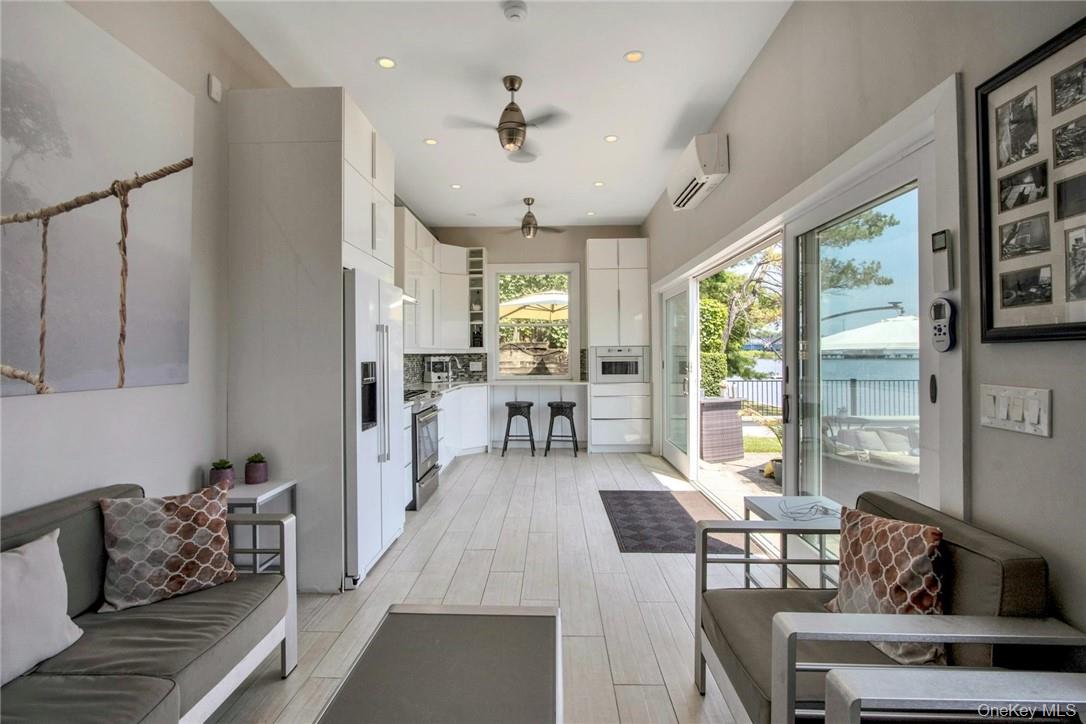 74 River Road Nyack, NY 10960 - Photo 31 of 36 a living room with furniture and a large window