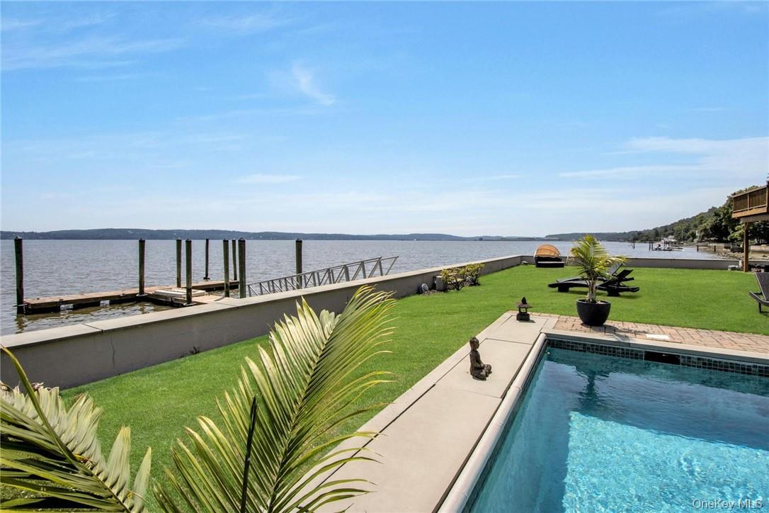 74 River Road Nyack, NY 10960 - Photo 35 of 36 a view of a swimming pool and lounge chair