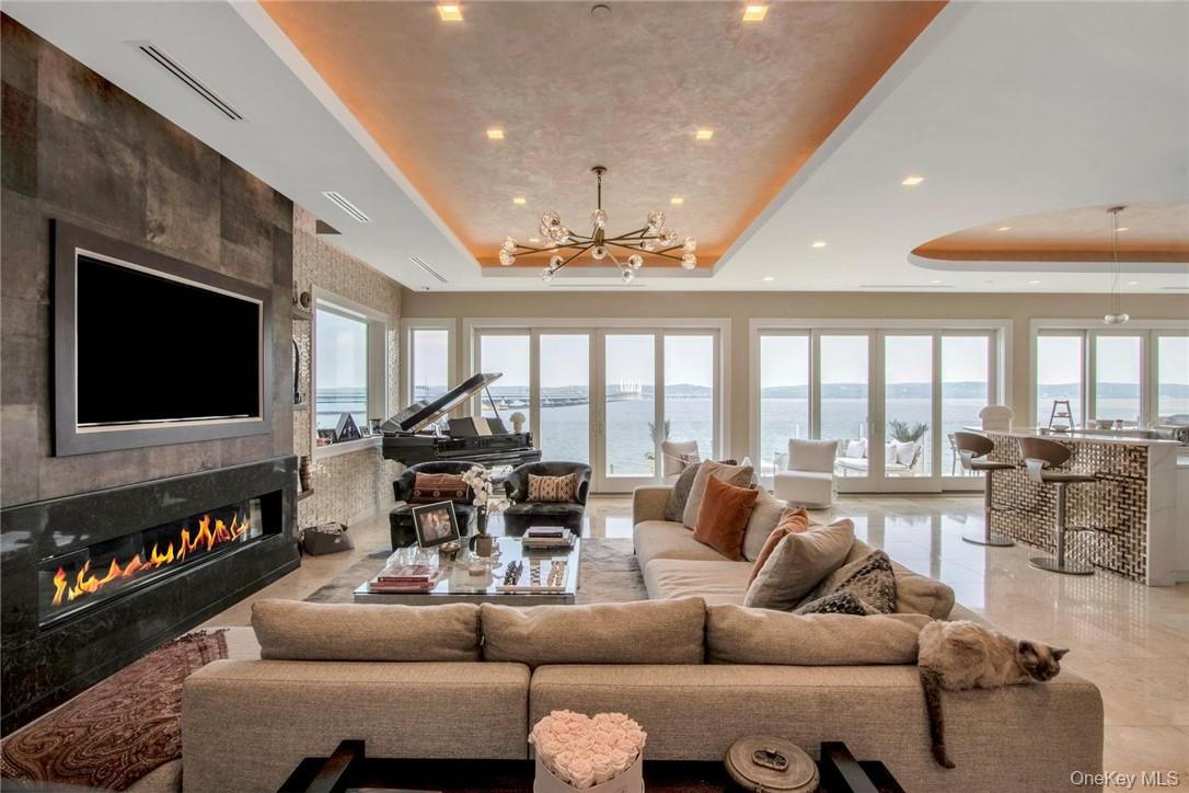 74 River Road Nyack, NY 10960 - Photo 6 of 36 a living room with furniture and a flat screen tv