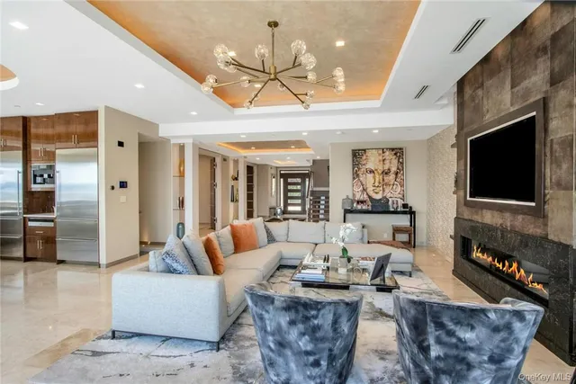 a living room with fireplace furniture and a flat screen tv