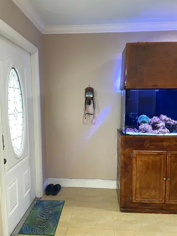 a room with furniture and a flat screen tv