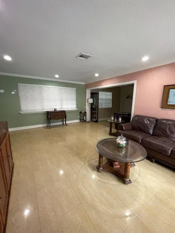 a kitchen with stainless steel appliances granite countertop a stove and a microwave