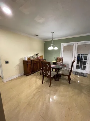 a view of a workspace with furniture