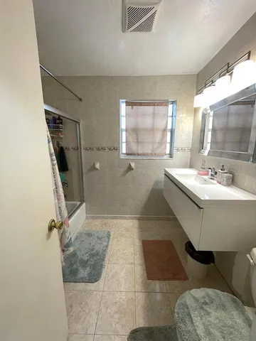 a bathroom with a sink and mirror