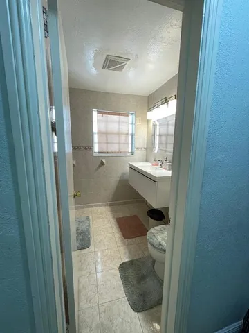 a room with wooden floor and a window