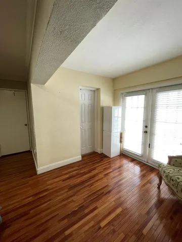 a bed room with a bed and a chair