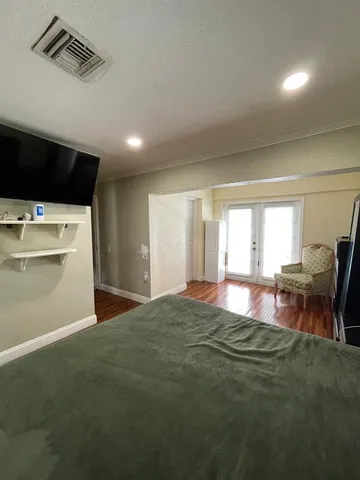 a view of hall with wooden floor