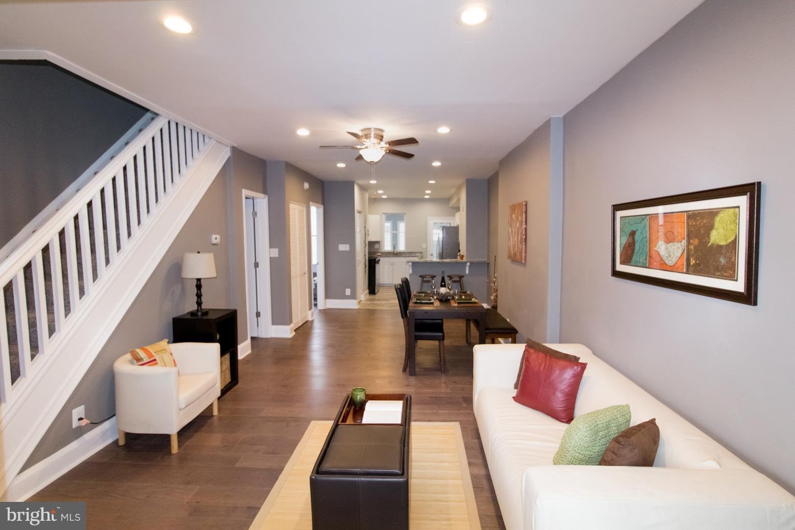 1743 Portship Road Baltimore, MD 21222 - Photo 1 of 30 a living room with furniture and wooden floor
