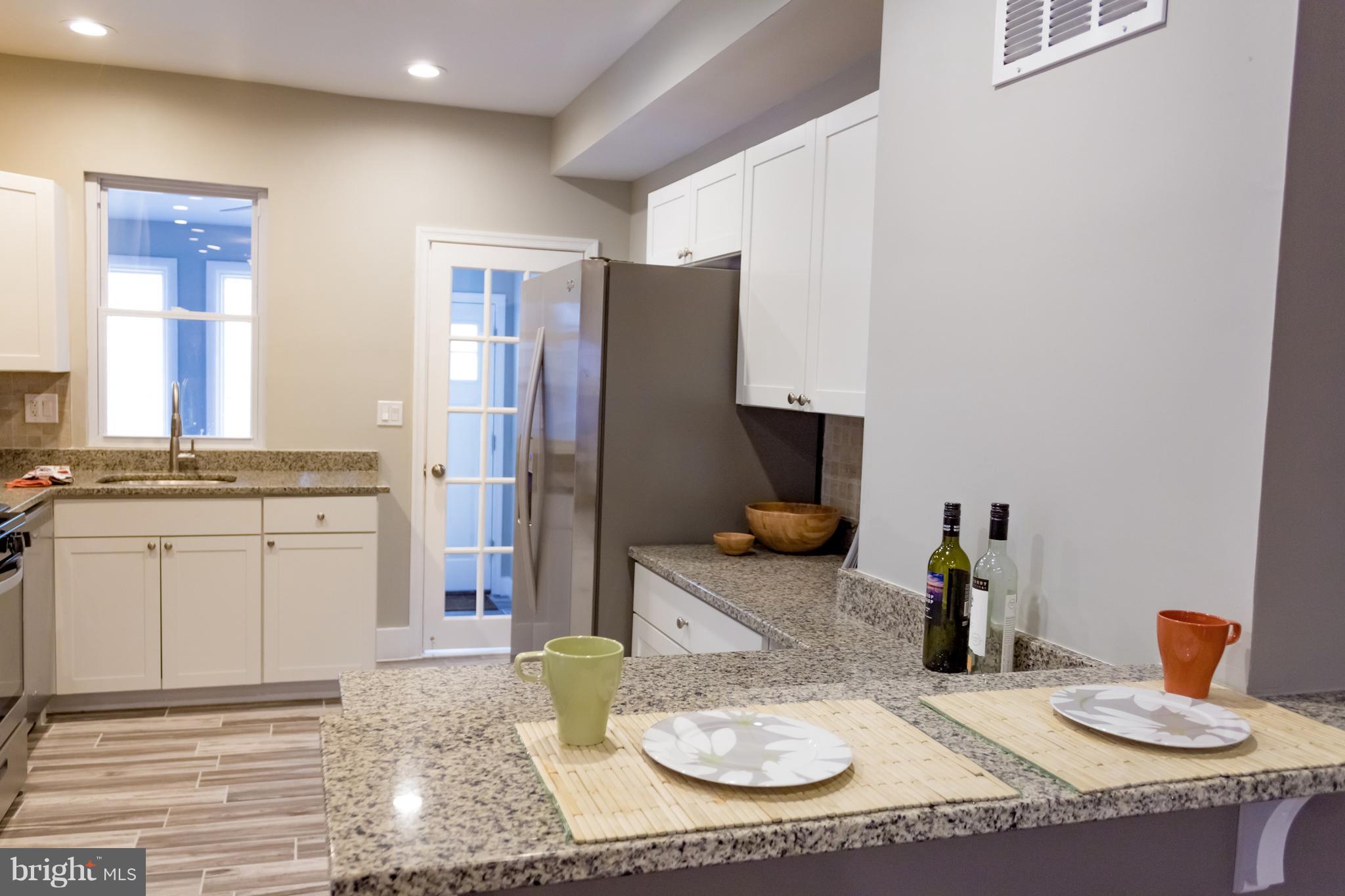 1743 Portship Road Baltimore, MD 21222 - Photo 11 of 30 a kitchen with sink and refrigerator