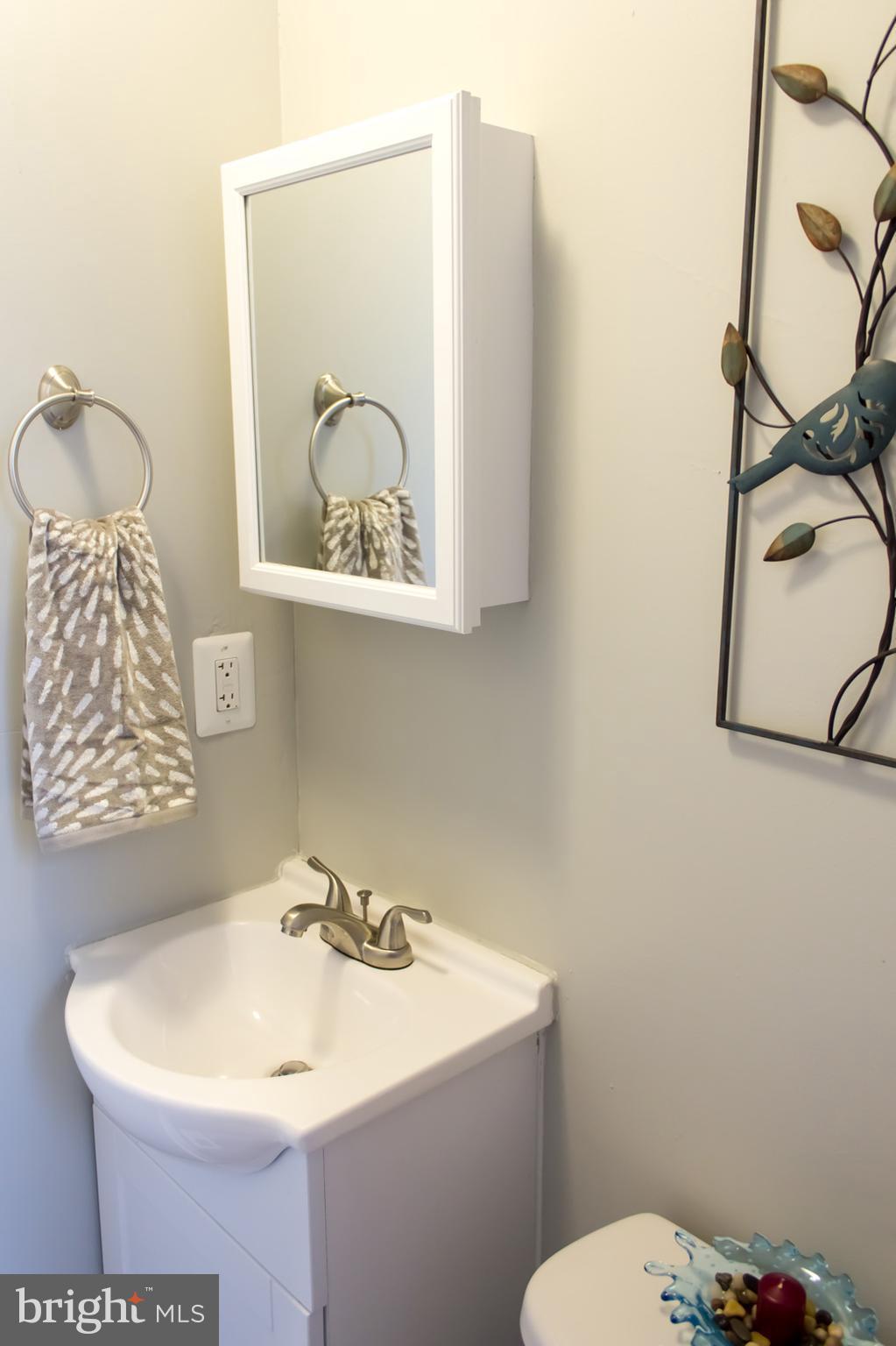 1743 Portship Road Baltimore, MD 21222 - Photo 15 of 30 a bathroom with a toilet sink and mirror