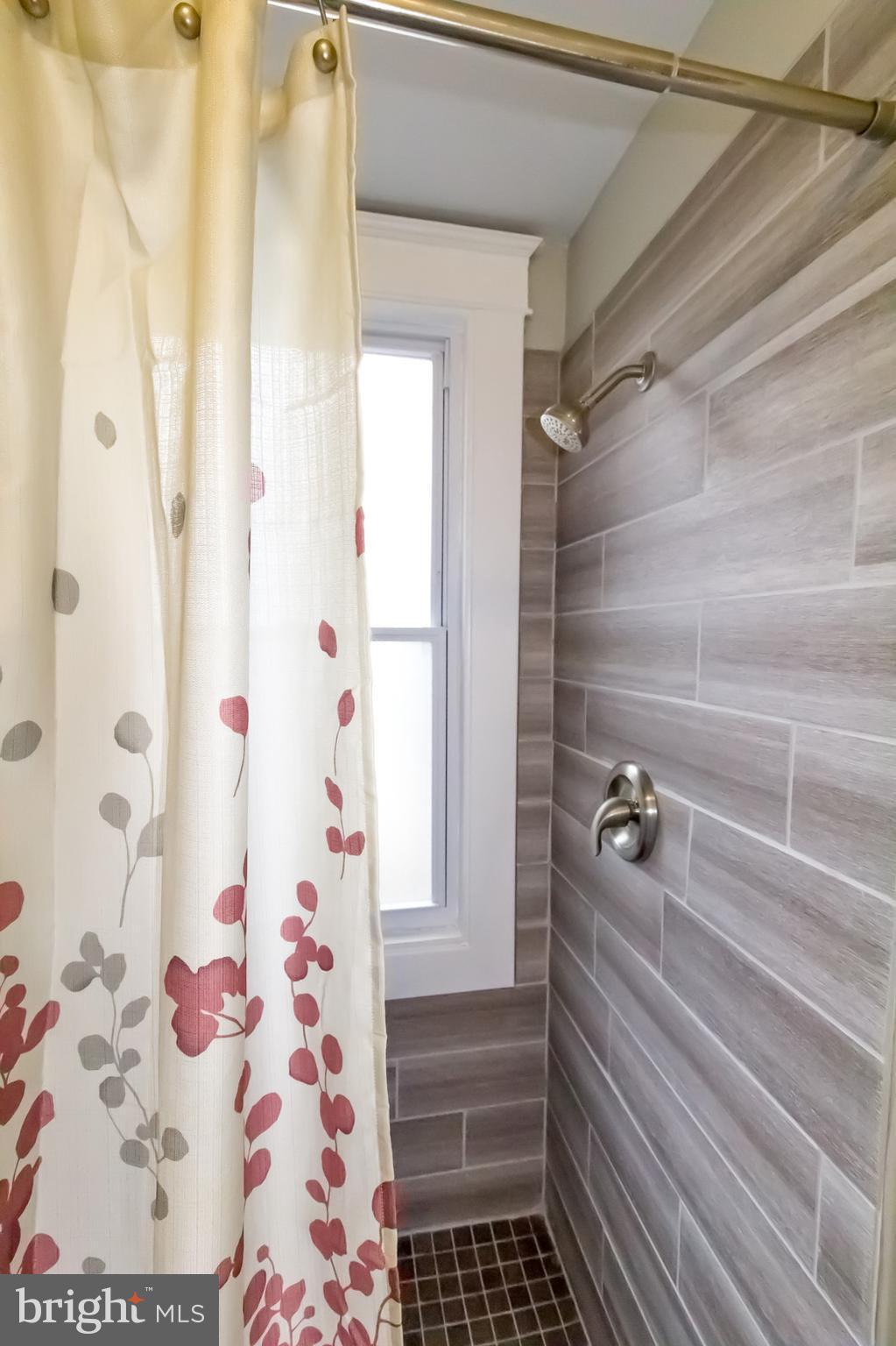 1743 Portship Road Baltimore, MD 21222 - Photo 16 of 30 a bathroom with a shower