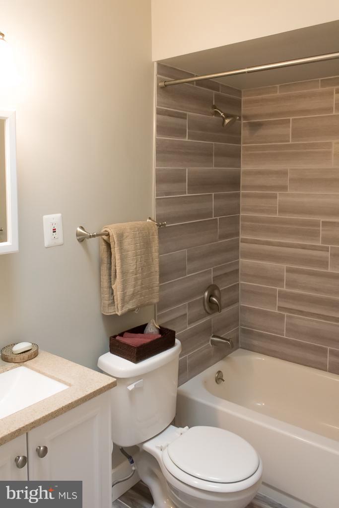 1743 Portship Road Baltimore, MD 21222 - Photo 24 of 30 a bathroom with a toilet a sink and bathtub