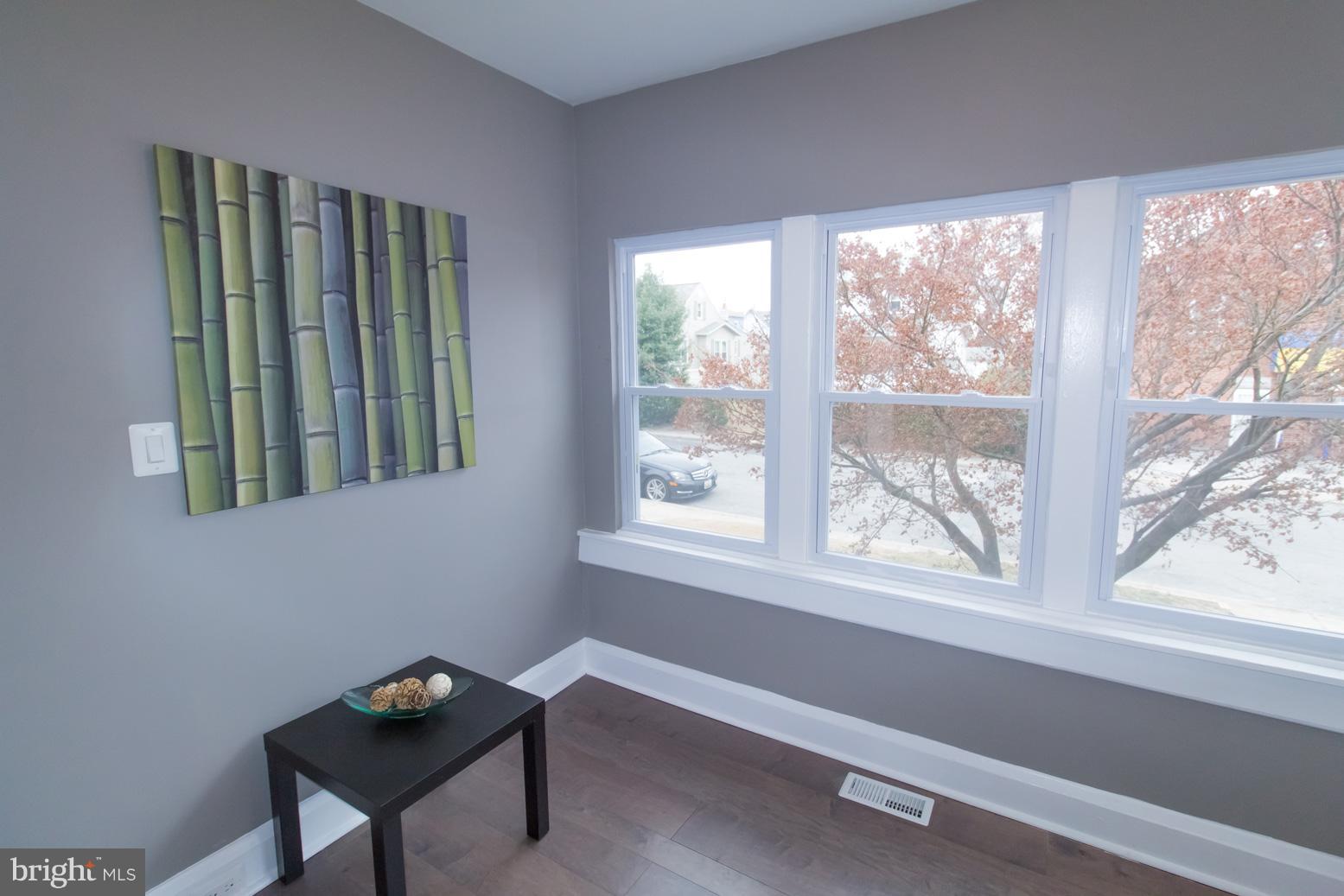1743 Portship Road Baltimore, MD 21222 - Photo 6 of 30 a view of a room that has a window and wooden floor