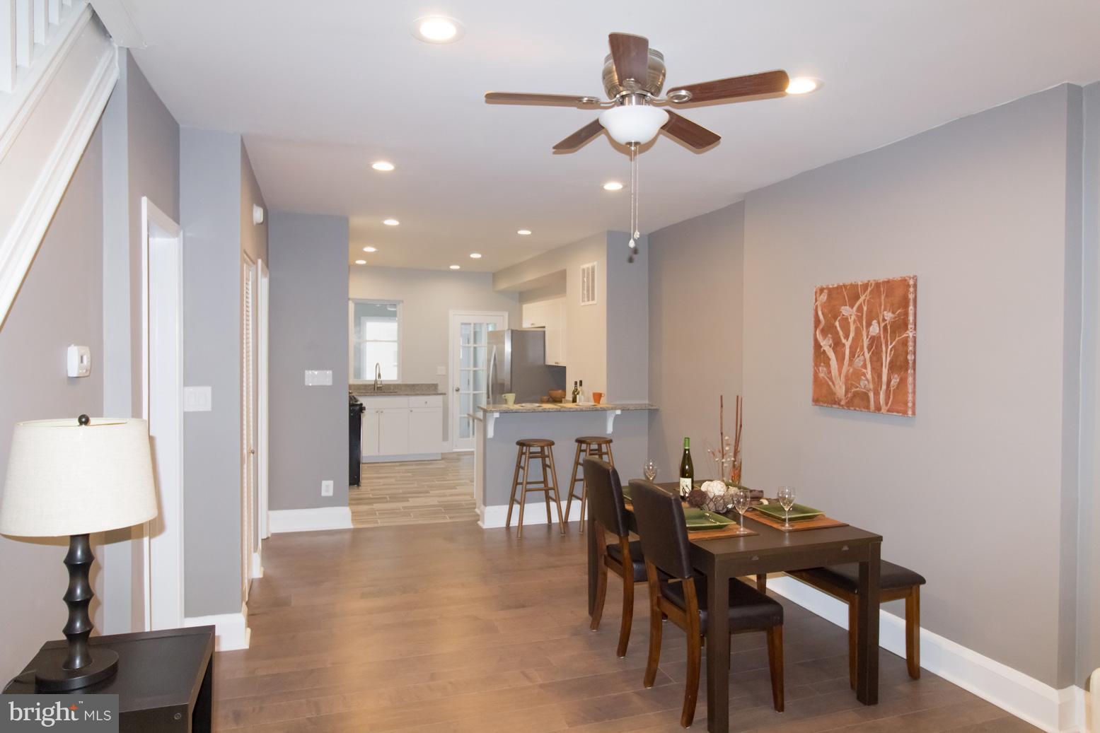 1743 Portship Road Baltimore, MD 21222 - Photo 8 of 30 a view of a a dining room with furniture window and wooden floor