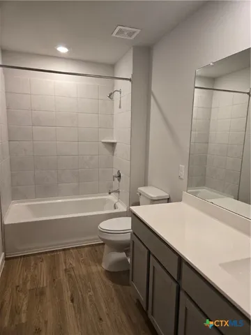 a bathroom with a sink a toilet and a bathtub