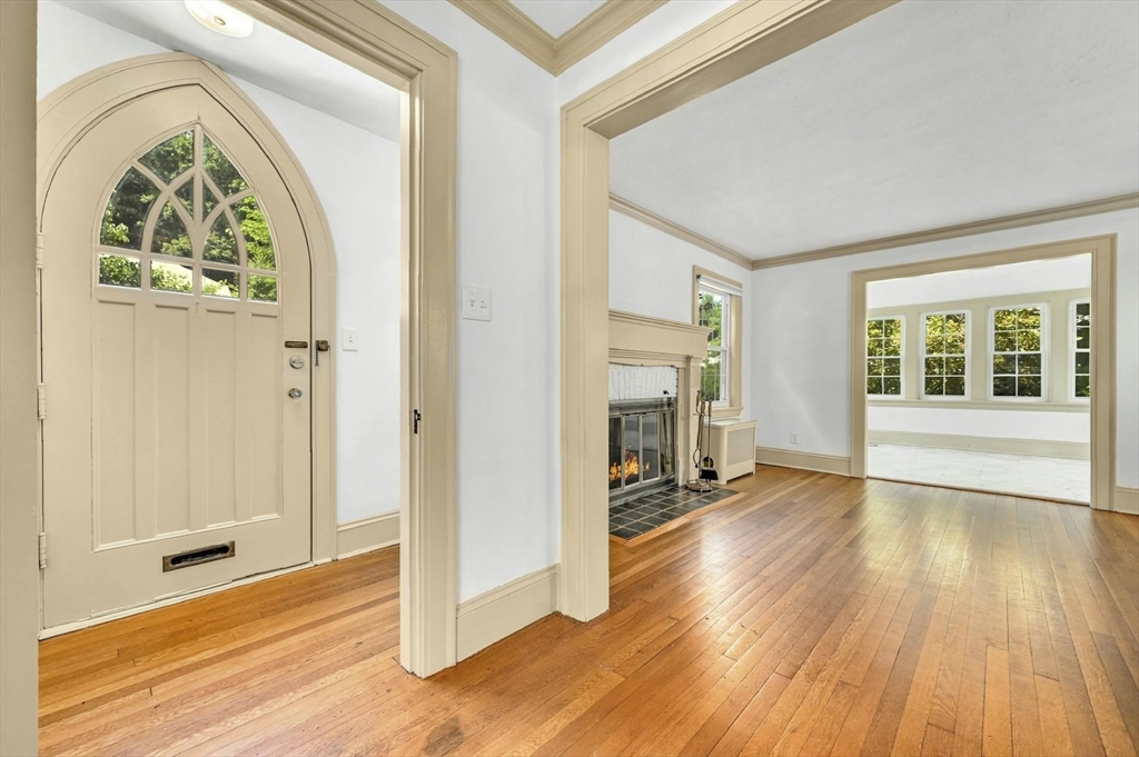41 Flagg Street Worcester, MA 01602 - Photo 17 of 31 an empty room with wooden floor fireplace and windows