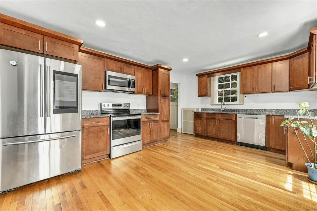41 Flagg Street Worcester, MA 01602 - Photo 2 of 31 a kitchen with stainless steel appliances granite countertop a refrigerator and a stove top oven