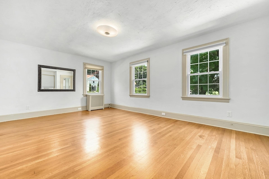 41 Flagg Street Worcester, MA 01602 - Photo 22 of 31 a view of an empty room with wooden floor and a window