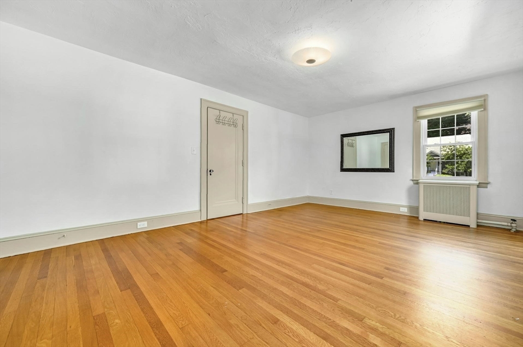 41 Flagg Street Worcester, MA 01602 - Photo 24 of 31 a view of empty room with wooden floor and fan