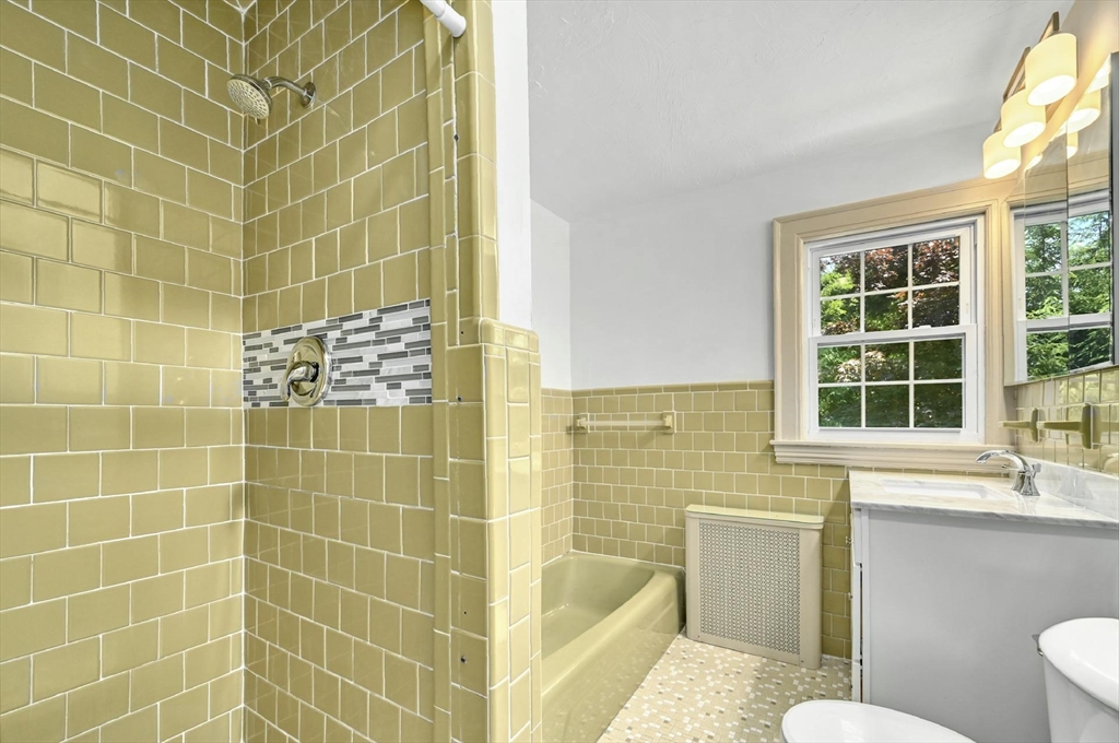 41 Flagg Street Worcester, MA 01602 - Photo 5 of 31 a bathroom with a sink a toilet a window and bathtub
