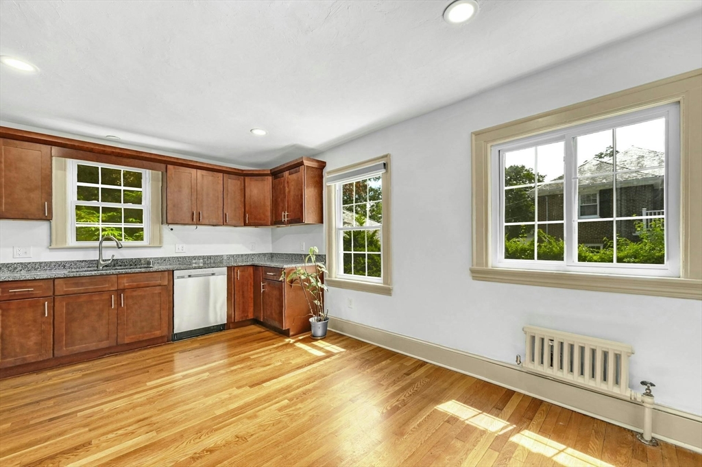 41 Flagg Street Worcester, MA 01602 - Photo 8 of 31 a kitchen with granite countertop a stove a sink and cabinets