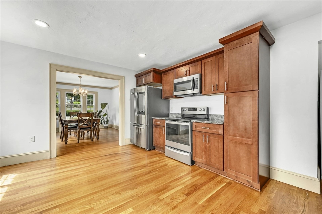 41 Flagg Street Worcester, MA 01602 - Photo 9 of 31 a kitchen with stainless steel appliances granite countertop a refrigerator stove top oven and sink
