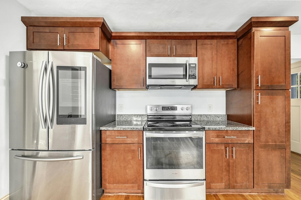 41 Flagg Street Worcester, MA 01602 - Photo 10 of 31 a kitchen with stainless steel appliances granite countertop a refrigerator a stove a sink and dishwasher