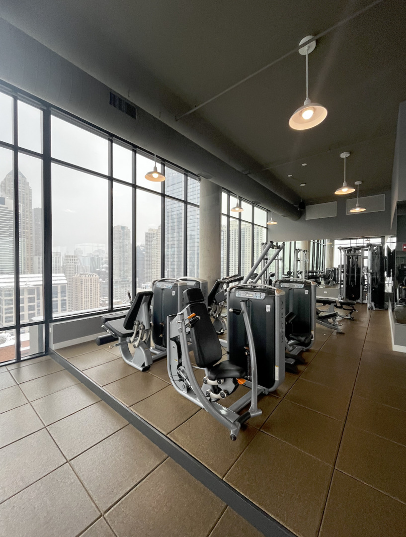 833 North Clark Street, Unit 2408 Chicago, IL 60610 - Photo 14 of 21 a view of a room with gym equipment