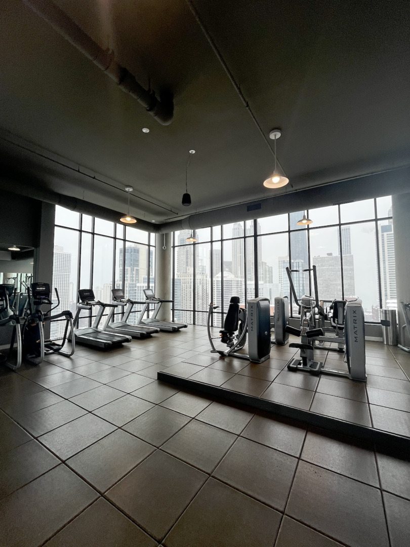 833 North Clark Street, Unit 2408 Chicago, IL 60610 - Photo 16 of 21 a group of people sitting in a room