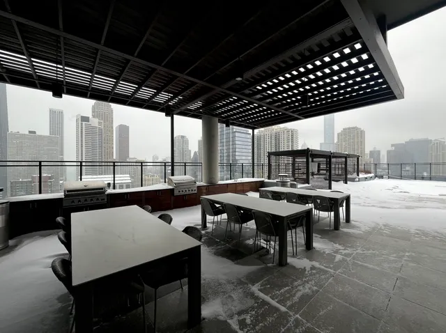 a view of roof deck with city view