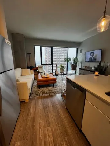 a bed room with a bed and a large window