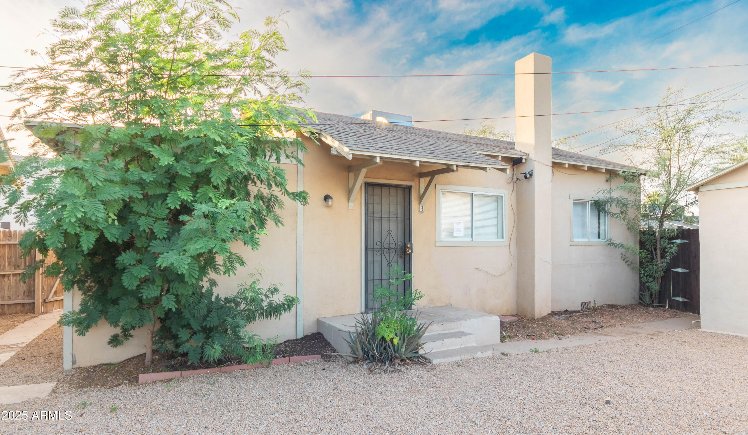2032 West Adams Street, Unit 3 Phoenix, AZ 85009 - Photo 1 of 10 a view of a house with potted plants