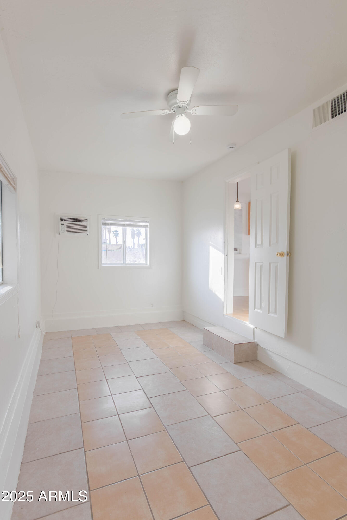 2032 West Adams Street, Unit 3 Phoenix, AZ 85009 - Photo 10 of 10 a view of an empty room with a window