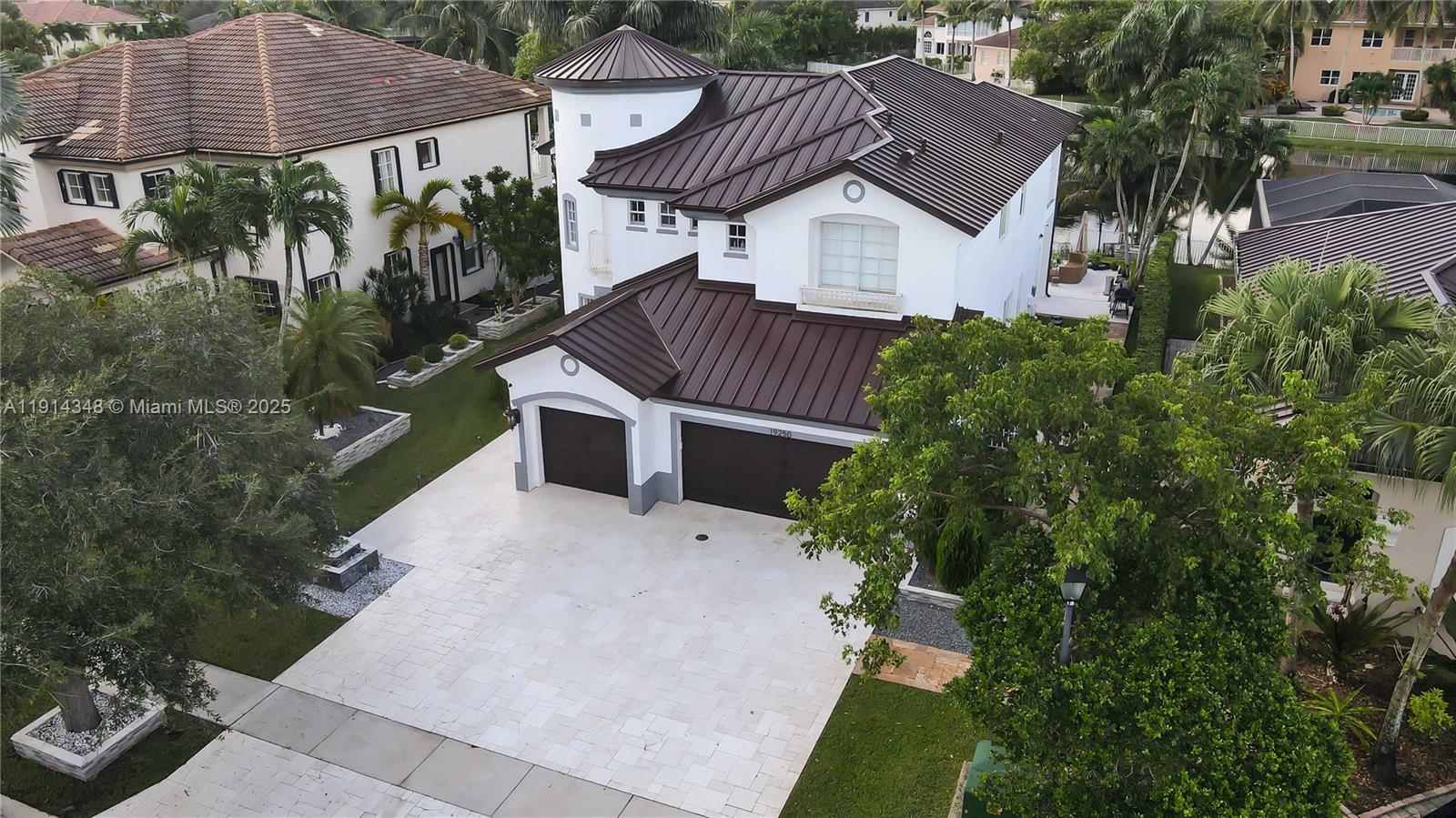19250 Southwest 30th Street, Unit 50 Miramar, FL 33029 - Photo 1 of 61 a aerial view of a house with a yard and potted plants
