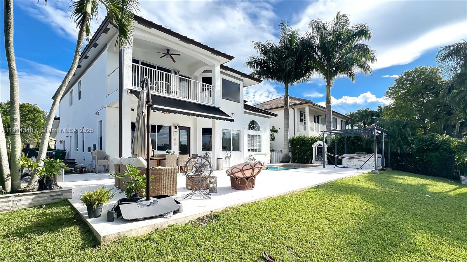 19250 Southwest 30th Street, Unit 50 Miramar, FL 33029 - Photo 16 of 61 a view of a house with backyard porch and sitting area
