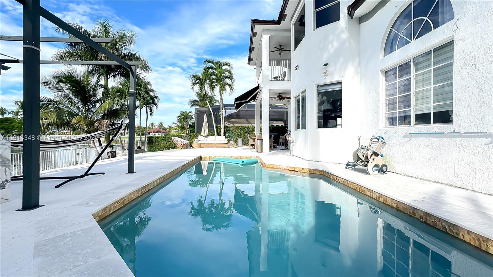 19250 Southwest 30th Street, Unit 50 Miramar, FL 33029 - Photo 17 of 61 a view of a swimming pool with a patio