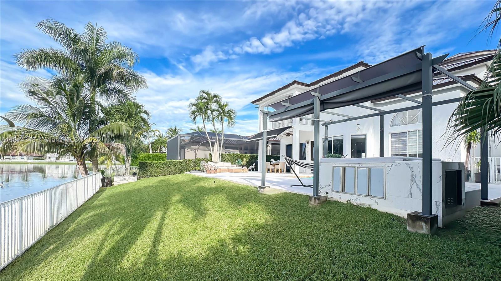 19250 Southwest 30th Street, Unit 50 Miramar, FL 33029 - Photo 18 of 61 a view of house with yard and sitting area