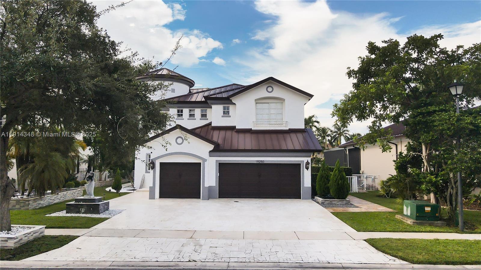 19250 Southwest 30th Street, Unit 50 Miramar, FL 33029 - Photo 2 of 61 a front view of a house with a garden and trees