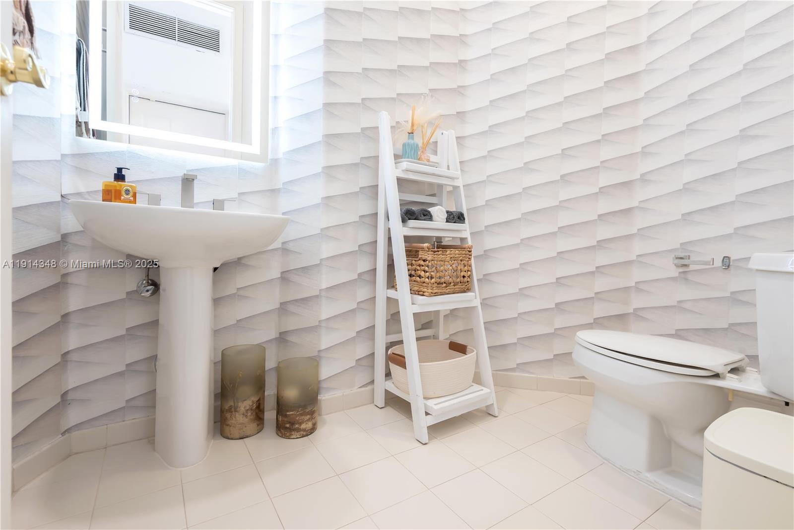 19250 Southwest 30th Street, Unit 50 Miramar, FL 33029 - Photo 36 of 61 a bathroom with a toilet and a sink