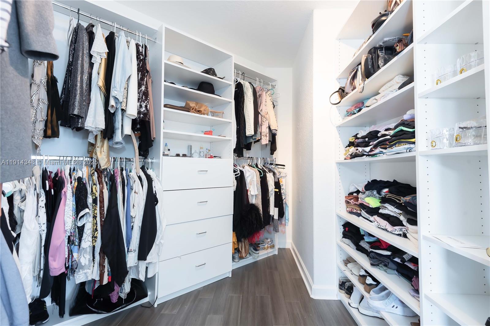 19250 Southwest 30th Street, Unit 50 Miramar, FL 33029 - Photo 53 of 61 a view of walk in closet with clothes and shoes