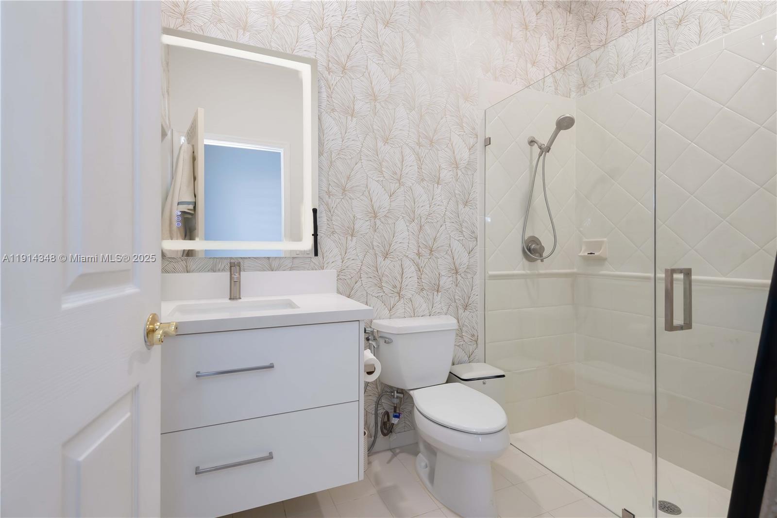 19250 Southwest 30th Street, Unit 50 Miramar, FL 33029 - Photo 58 of 61 a bathroom with a sink a toilet and shower