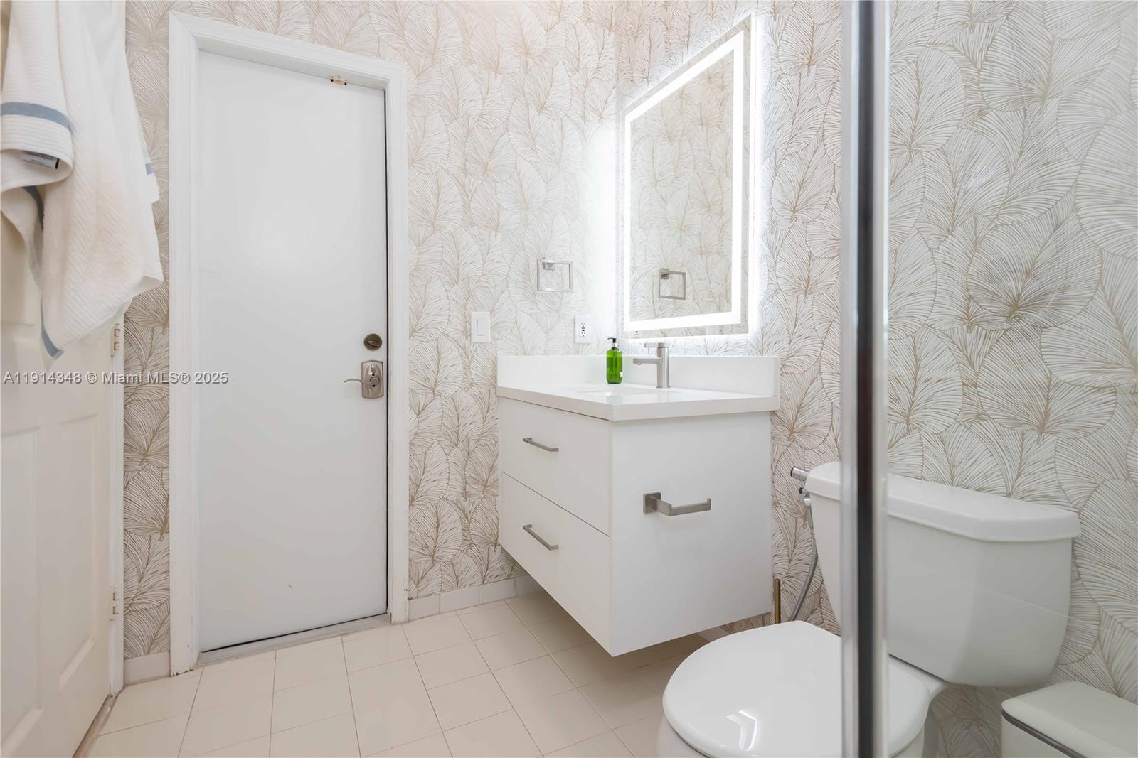 19250 Southwest 30th Street, Unit 50 Miramar, FL 33029 - Photo 59 of 61 a bathroom with a sink a toilet and shower