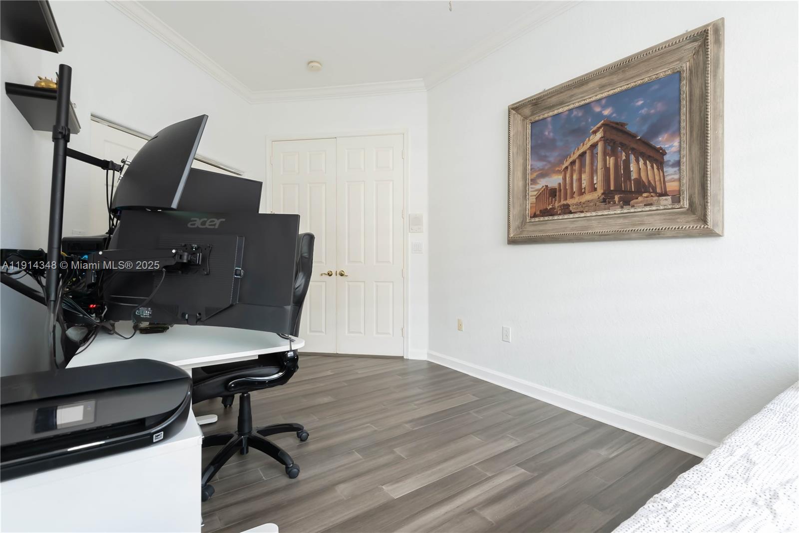 19250 Southwest 30th Street, Unit 50 Miramar, FL 33029 - Photo 60 of 61 a view of a workspace with furniture and wooden floor