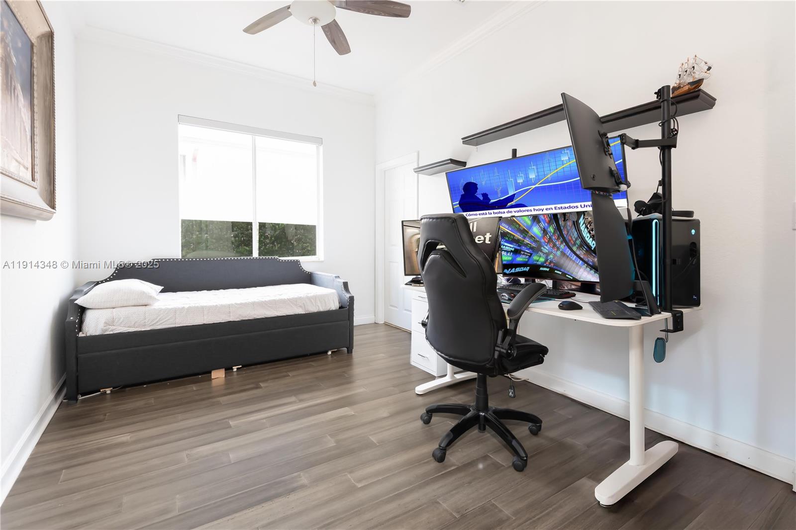 19250 Southwest 30th Street, Unit 50 Miramar, FL 33029 - Photo 61 of 61 a bedroom with a bed a desk and chair