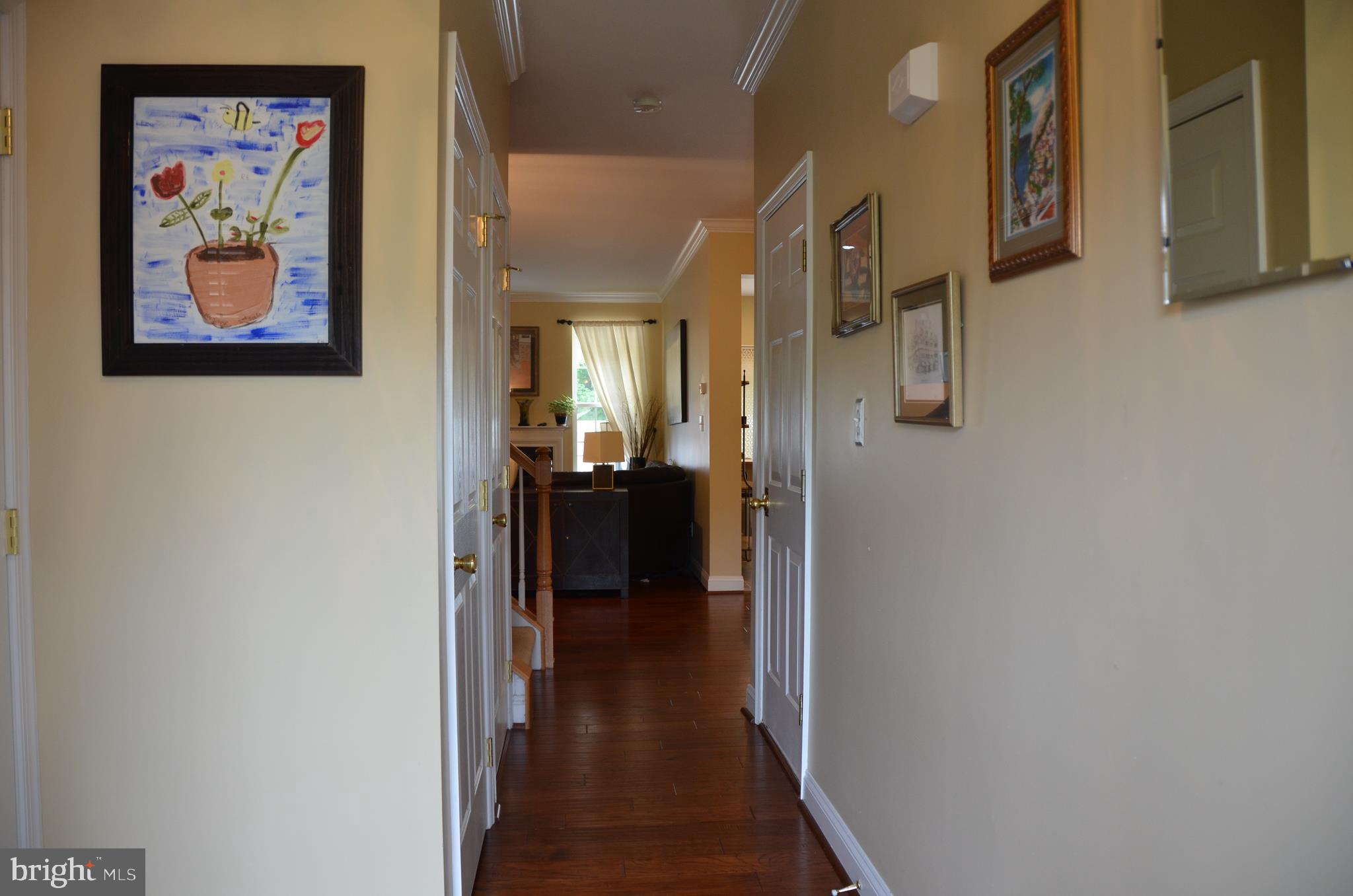 113 Warwick Road Princeton Junction, NJ 08550 - Photo 2 of 31 a view of a hallway with wooden floor