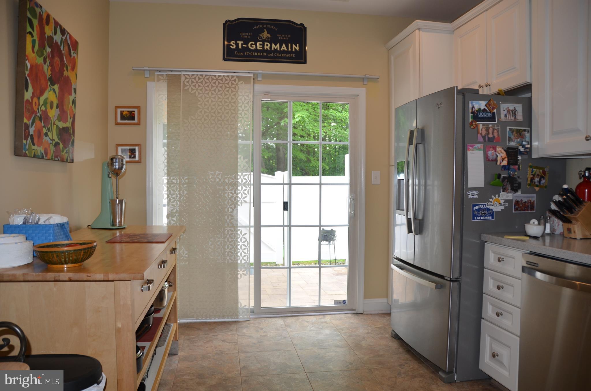 113 Warwick Road Princeton Junction, NJ 08550 - Photo 11 of 31 a kitchen with stainless steel appliances a refrigerator a stove a microwave and a window