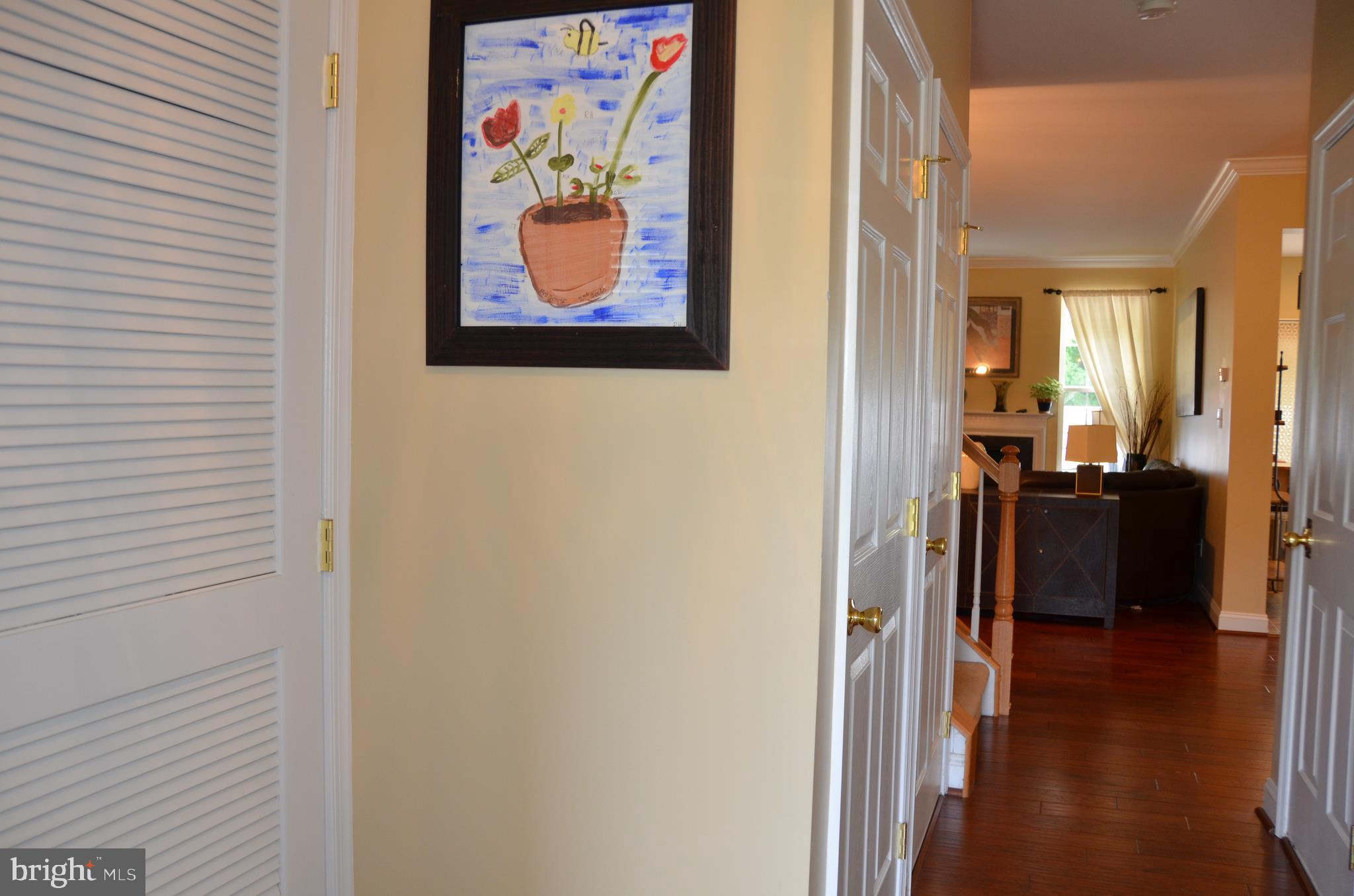 113 Warwick Road Princeton Junction, NJ 08550 - Photo 3 of 31 a view of a hallway with wooden floor and dining room