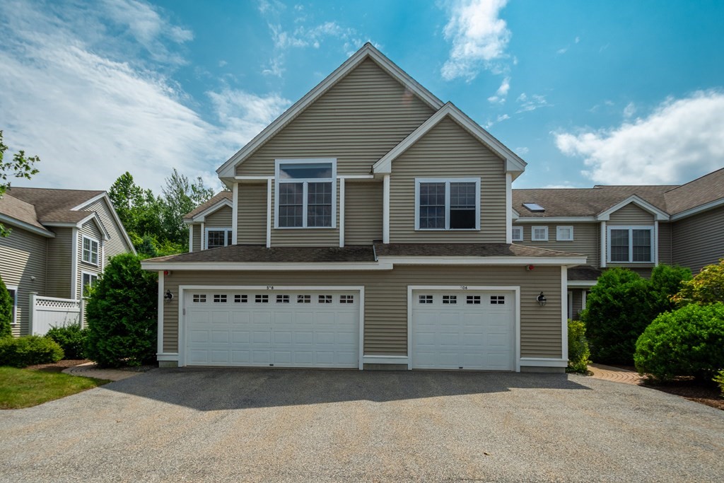 508 Linwood Court, Unit 508 Clinton, MA 01510 - Photo 1 of 28 a front view of a house with a garden and garage