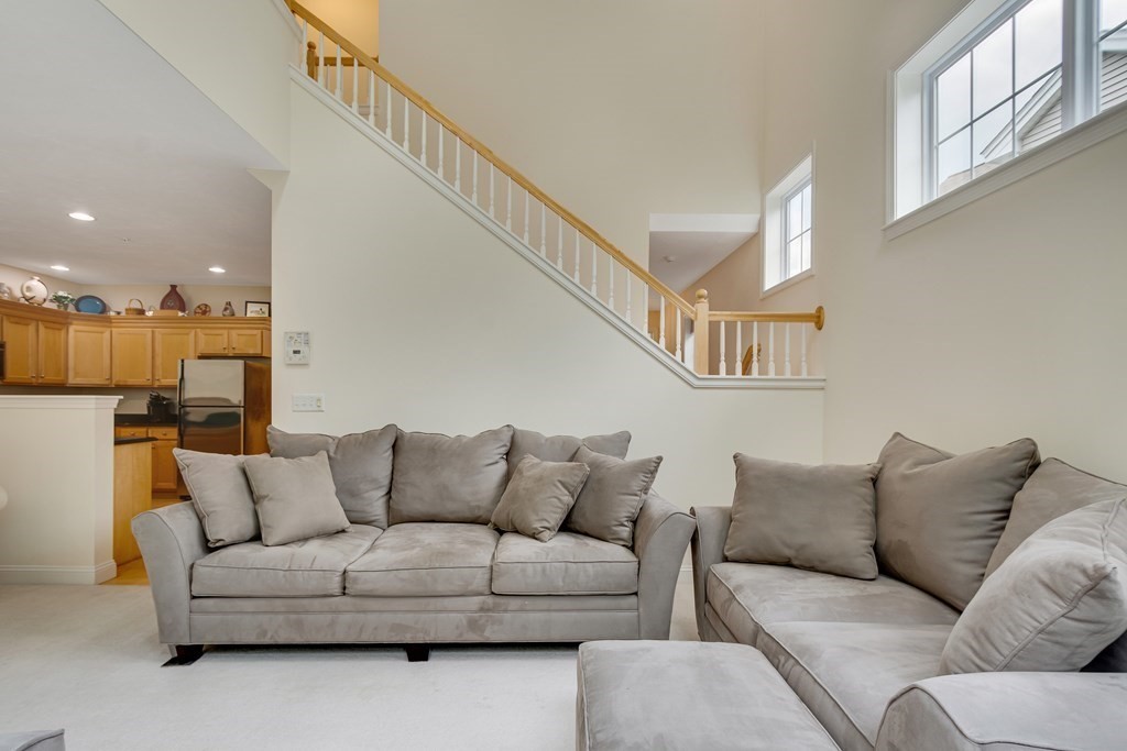 508 Linwood Court, Unit 508 Clinton, MA 01510 - Photo 13 of 28 a living room with furniture and a ceiling fan