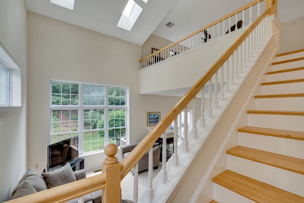 508 Linwood Court, Unit 508 Clinton, MA 01510 - Photo 17 of 28 a view of staircase with wooden floor and a potted plant